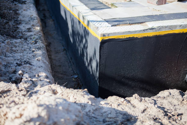 Professional Basement Waterproofing technician working in Greenfield, MN